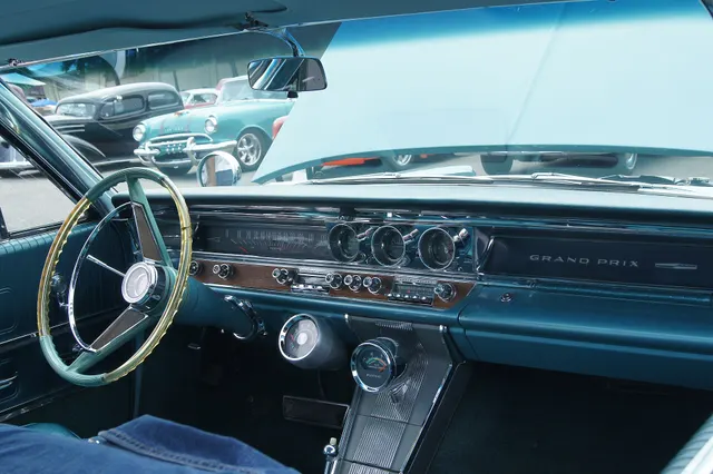 Exact-year stock-presenting view retained for body, trim, glass, lamp, bumper, and wheel context; condition and restoration details remain specific to the photographed car.