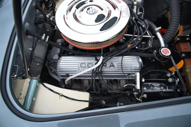 Restored 289 installation in CSX2125 showing Cobra valve covers and induction context; casting, assembly, carburetor, finish, and dates require inspection.