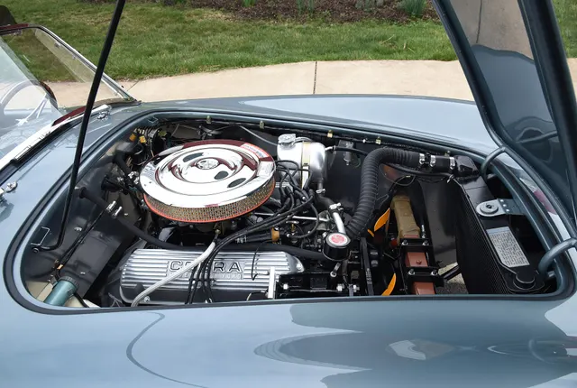 Broader engine-bay view of restored CSX2125, useful for layout and service-access context without claiming born-with component identity.