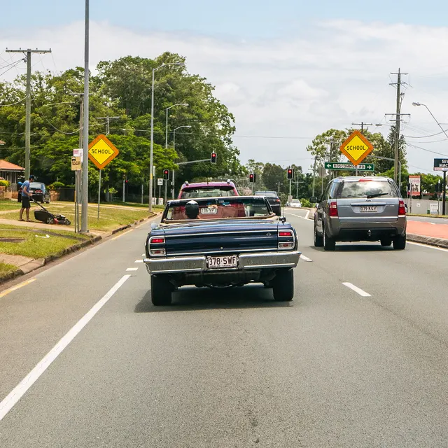 Exact-year stock-presenting view retained for body, trim, glass, lamp, bumper, and wheel context; condition and restoration details remain specific to the photographed car.