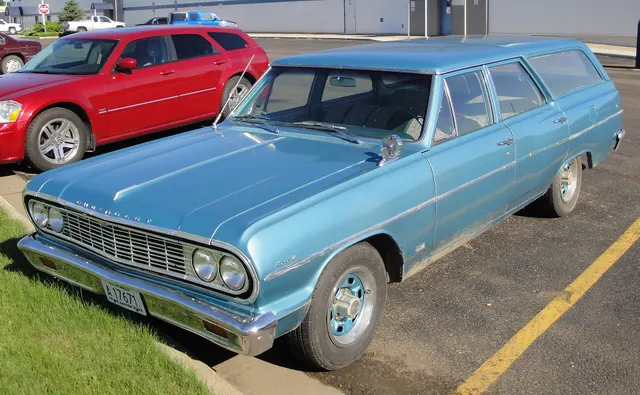 Exact-year stock-presenting view retained for body, trim, glass, lamp, bumper, and wheel context; condition and restoration details remain specific to the photographed car.
