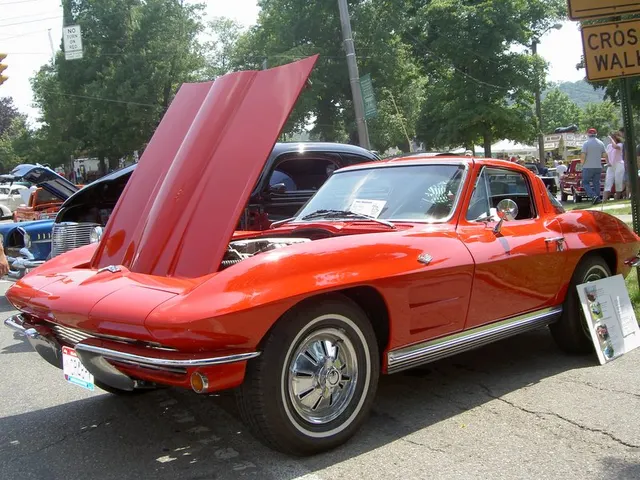 Restored red fuel-injected 1964 coupe with the hood open; the image provides restoration context rather than proof of original L84 equipment.