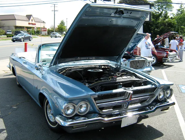 Front three-quarter view of an exact-year 300K convertible showing the open body, grille, hood, windshield, and convertible proportions.