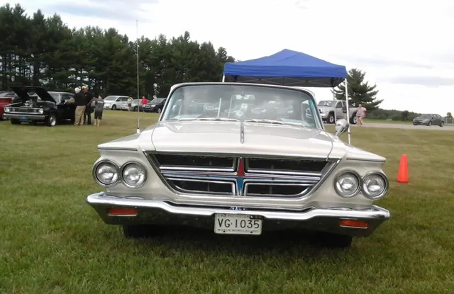 Front detail of an exact-model hardtop showing the grille, paired headlamps, bumper, hood edge, and letter-car presentation.