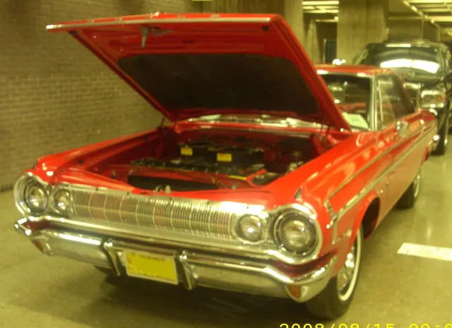 1964 Dodge Polara 500 with its engine bay open. The photograph provides layout context only and does not identify the installed engine as a Ramcharger 426.