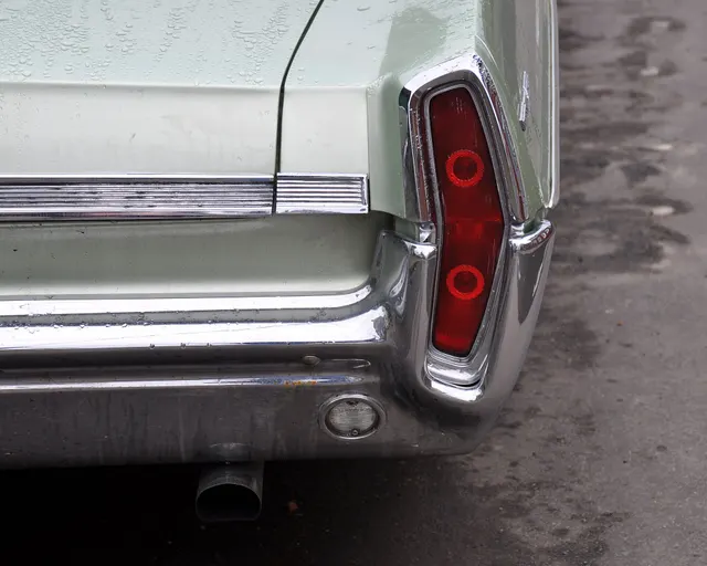 Exact-year stock-presenting view retained for body, trim, glass, lamps, bumpers, and wheel context; restoration details remain specific to the photographed car.