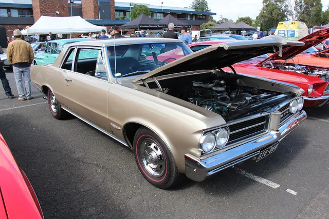1964 Pontiac GTO coupe; used for pillared/sports-coupe body-style context.