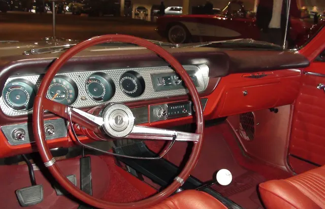 1964 Pontiac GTO interior at the GM Heritage Center; used for bucket-seat and dash-panel context.