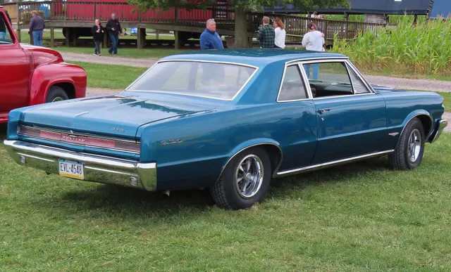 1964 Pontiac GTO Sports Coupe rear-right view; used for rear trim and deck-lid/badge context.
