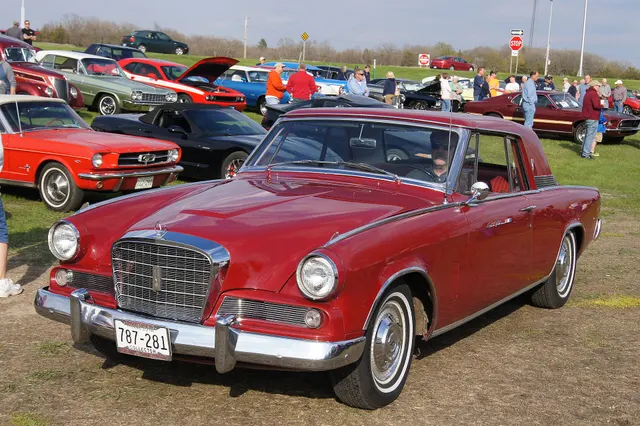 Opposite front three-quarter view showing the final-year grille and lamp treatment, hood and fender contours, formal roof, rear quarter, wheel covers, and stance.