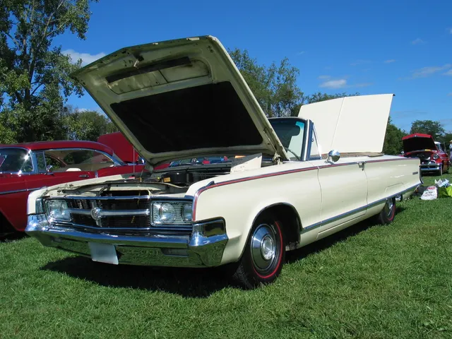 Exact-year 300L convertible showing the C45 open body, top-down cabin, grille, side molding, rear quarter, and proportions.