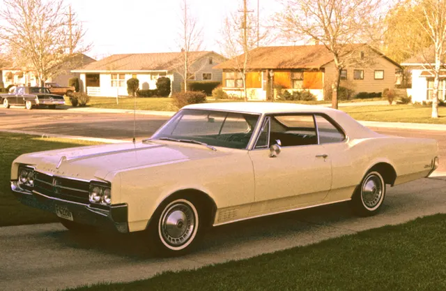 Exact-year view retained for body, trim, glass, lamps, bumpers, and wheel context; condition and restoration details remain specific to the photographed vehicle.