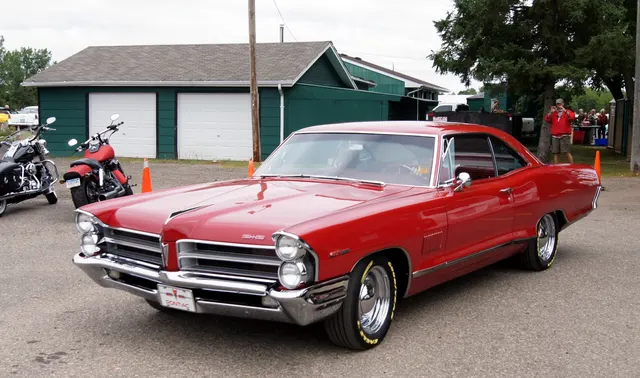 Red 1965 2+2 front three-quarter view