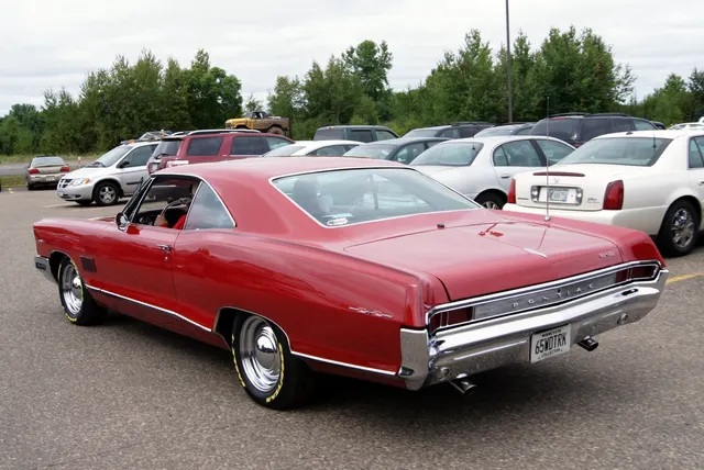 Red 1965 2+2 rear three-quarter view