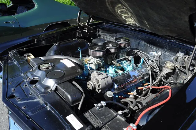 1965 Pontiac GTO engine bay; used as component and engine-bay context.