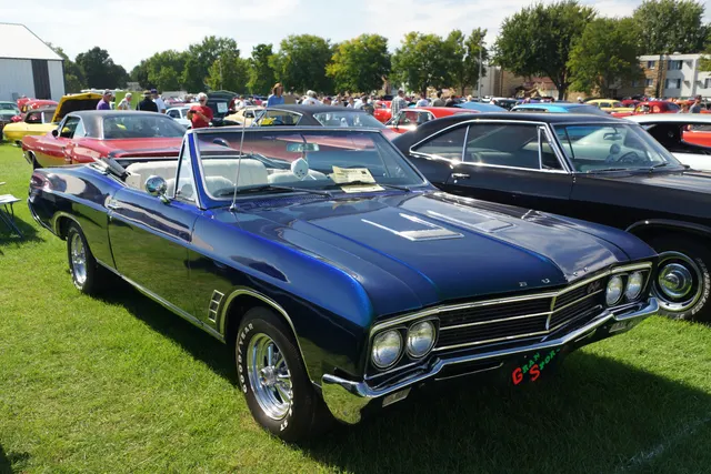 1966 Gran Sport convertible showing hood scoops, grille badge, and body profile