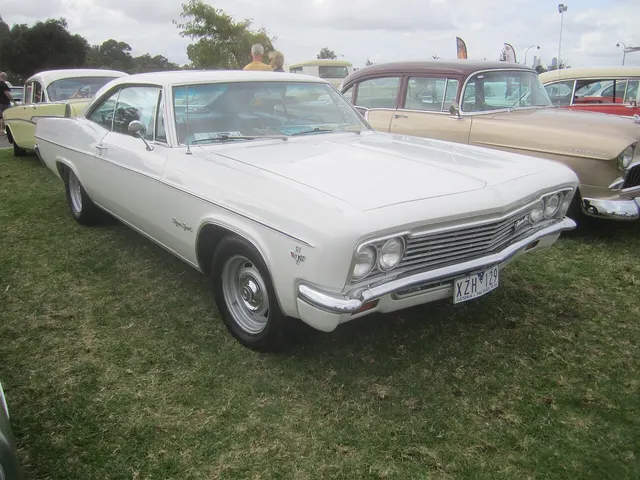 1966 Impala SS Sport Coupe showing the fastback roofline, fender script, and full-size proportions; verify wheels, tires, and drivetrain separately.