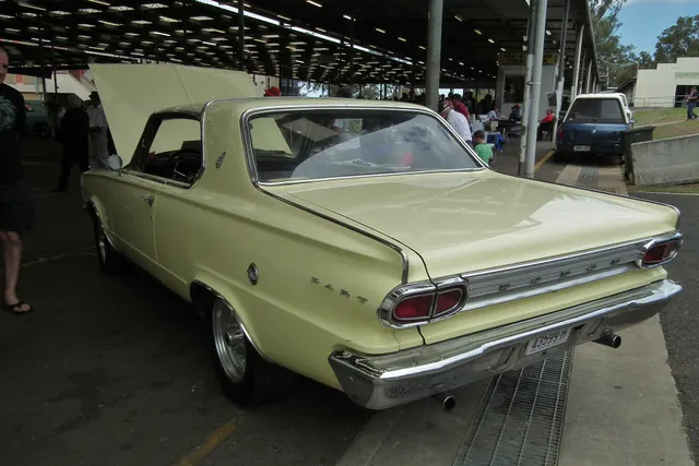 Rear three-quarter view retained for 1966 hardtop shell, glass, deck, lamps, bumper, and trim context; wheels, tires, exhaust, stance, engine, and other equipment are visibly modified and excluded from factory-specification evidence.