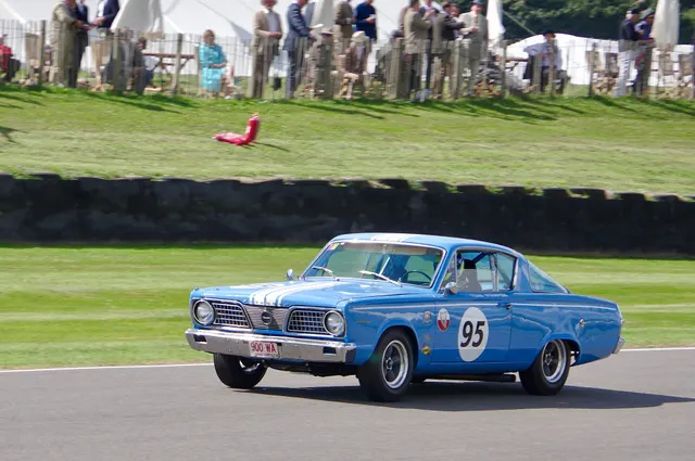 Exact-year competition-prepared Barracuda retained for body-in-motion and period-use context only; race numbers, stripes, wheels, tires, stance, cabin, and mechanical equipment are not factory-production evidence.