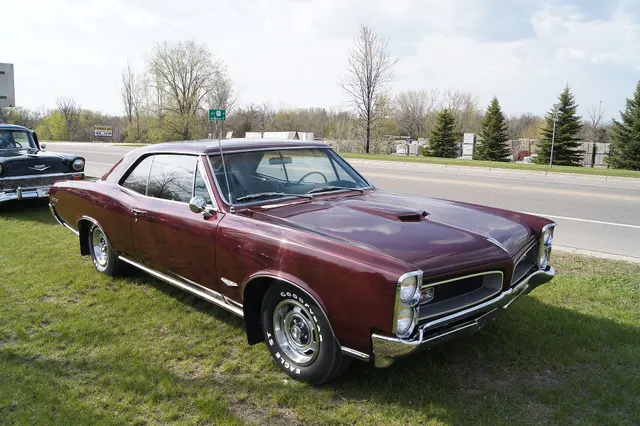 1966 Pontiac GTO side/context view; used for wheelbase, side-profile, and drivetrain-layout context without underbody claims.
