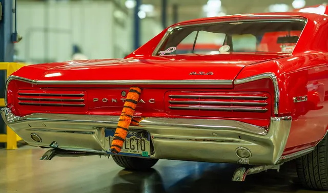 1966 Pontiac GTO tail view; used for horizontal louvered tail-lamp and rear badging context.