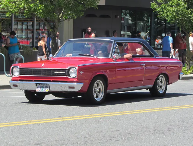 Modified 1966 Rambler American Rogue hardtop with a black roof