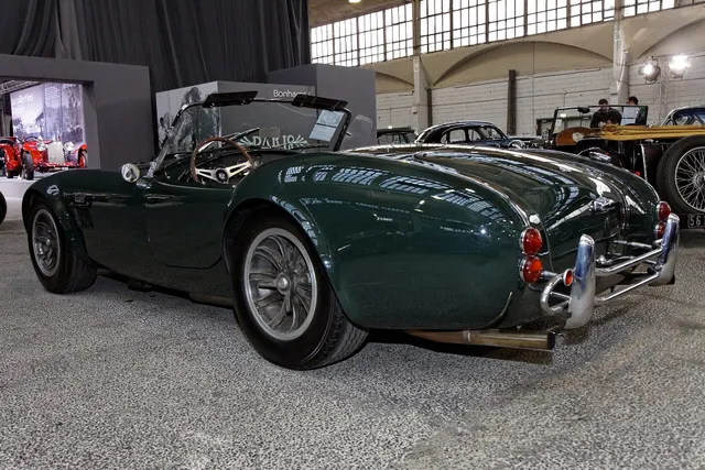 Alternate rear view of the same 1966 roadster; lighting, finish, trim, and hardware remain chassis-specific.
