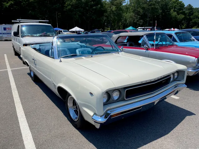 White SST convertible with the power top lowered