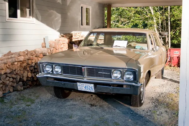 Exact-year four-door Beaumont sedan showing the regular-body grille, hood, roof pillars, door arrangement, body length, and factory-style wheel treatment.