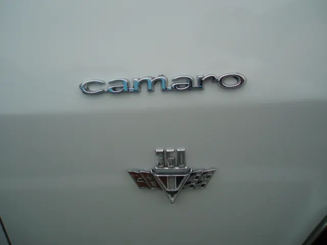 1967 Camaro RS/SS coupe front-fender badge detail; trim-identification context only.