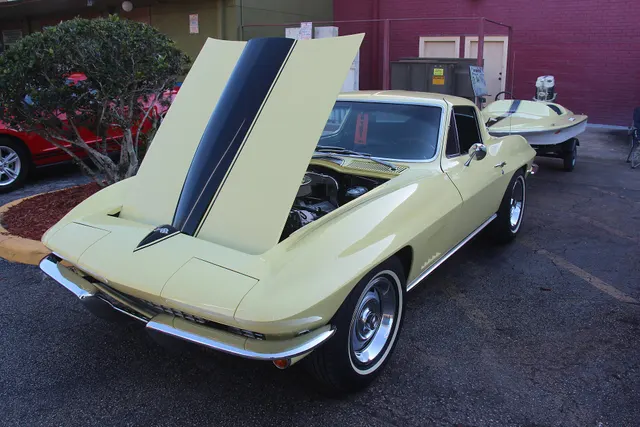Light-colored 1967 coupe with the hood raised, showing the second factory body style and front-end details.