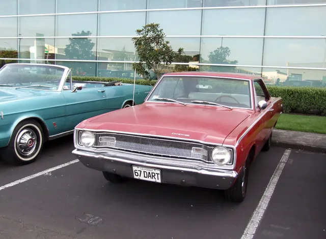 Exact-year Dart front view retained for grille, lamps, hood, bumper, glass, and sedan-body context; finish and condition remain subject-specific.