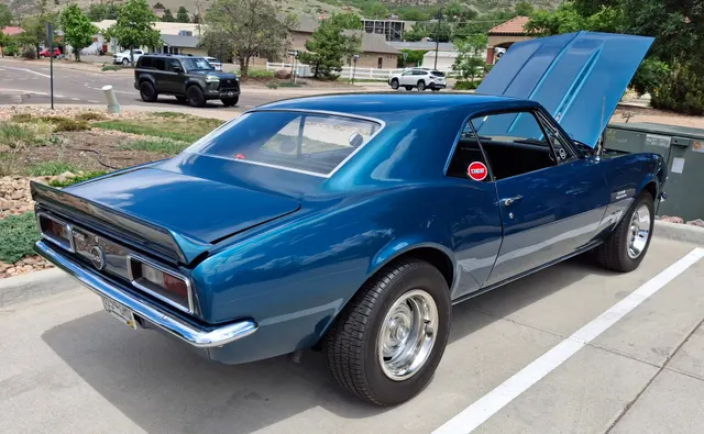 Rear three-quarter view of the same Nickey-labeled 1967 Camaro; representative restored exterior context, not authentication of dealer conversion paperwork.