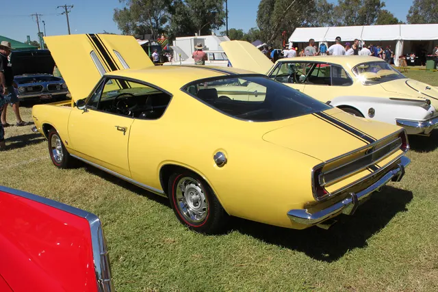 Exact-year stock-presenting view retained for body, trim, glass, lamps, bumpers, and wheel context; restoration details remain specific to the photographed car.