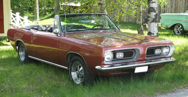 Exact-year convertible retained for open-body, grille, lamps, hood, trim, and cabin context; the photographed car has nonstock wheels and tires.