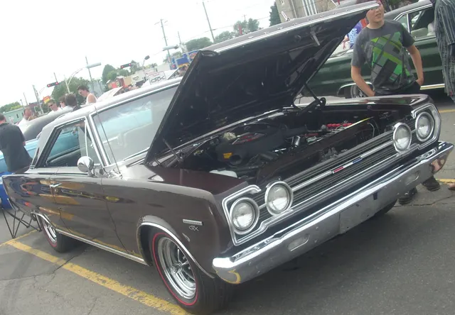 1967 Plymouth GTX with the hood open, showing Street Hemi engine-bay context