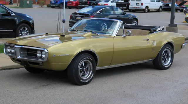 Licensed 1967 Pontiac Firebird 400 convertible in Signet Gold used as exact-year body and color context.