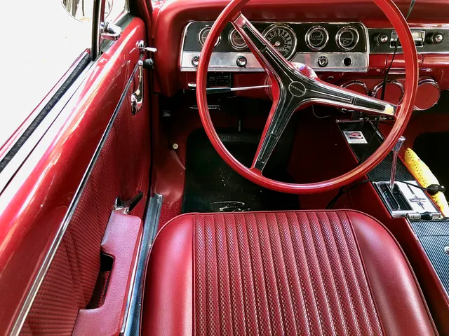 Cabin of the same exact-year Rogue retained for bucket upholstery, door trim, steering wheel, gauges, dashboard, console, automatic selector, pedals, and interior color context.