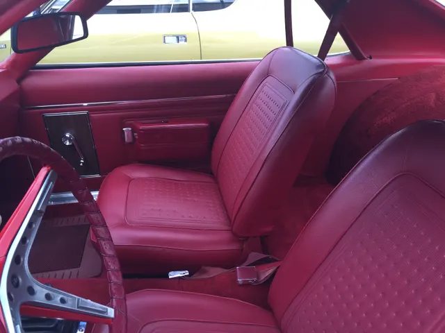 1968 AMC AMX rear-panel and stripe context from a white/red 390 Go Package example.