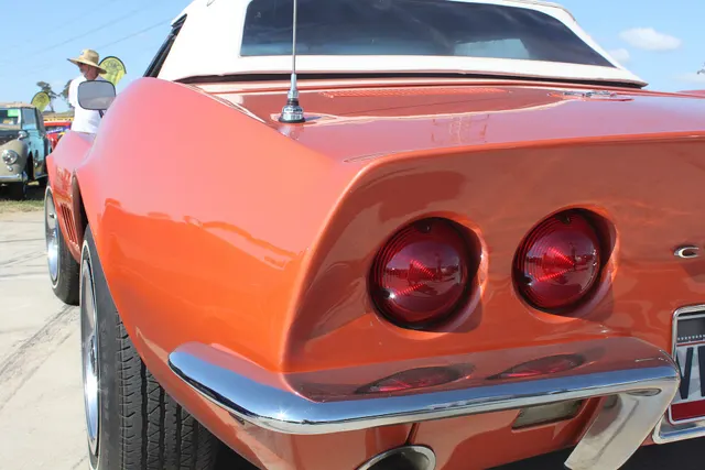 Close view of the 1968 rear quarter, taillamps, chrome bumper, antenna base, and body contour.