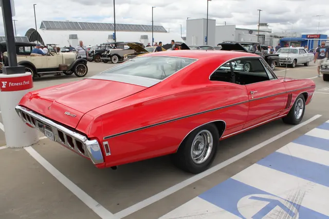 Licensed rear/side view of a 1968 Impala SS427 with rear badging and body-line context.