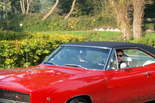 Detail crop from the approved Louwman Charger R/T image showing rear trim and tail-panel context.