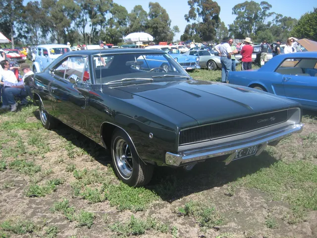 1968 Dodge Charger R/T rear three-quarter view showing rear-panel and stripe context.