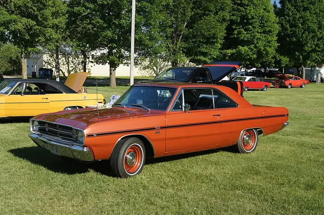 Orange 1968 Dodge Dart GTS 340 hardtop with color-keyed wheels and redline tires