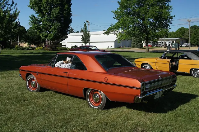 Orange 1968 Dodge Dart GTS 340 hardtop showing the side stripe and rear treatment