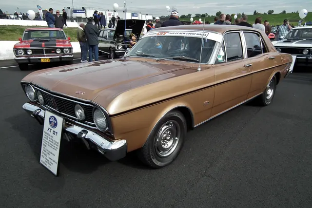 Exact-year XT GT front view showing the divided grille, inset driving lamps, bumper, hood, windshield, and GT stance.