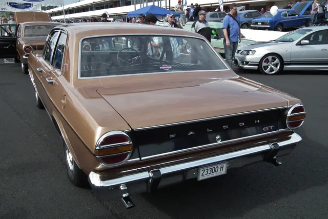 Exact-year XT GT rear three-quarter view showing the tail treatment, stripe termination, rear identification, roofline, and wheels.