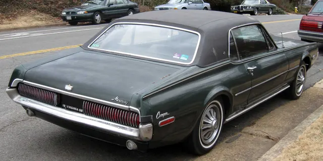 Exact-year Cougar rear view showing the model-year body, brightwork, fuel door, and sequential-lamp housing; the photograph does not establish GT-E identity.