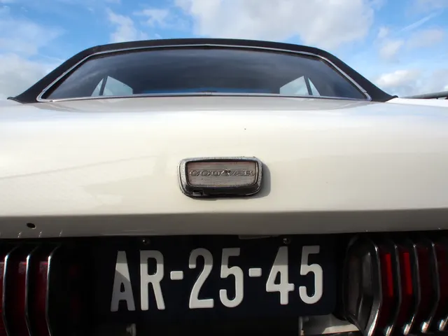 Exact-year Cougar close-up showing paint, rear badging, trunk brightwork, and sequential-lamp trim; no GT-E package identity is inferred.