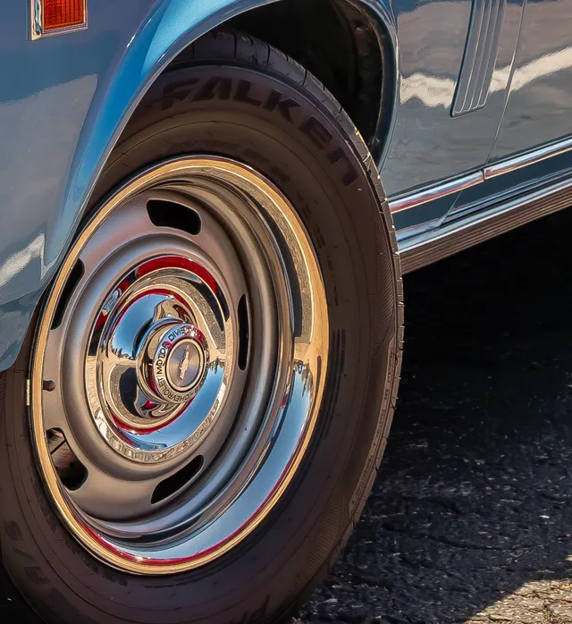 Local crop showing wheel, tire, and front-stance context on a 1968 Nova.